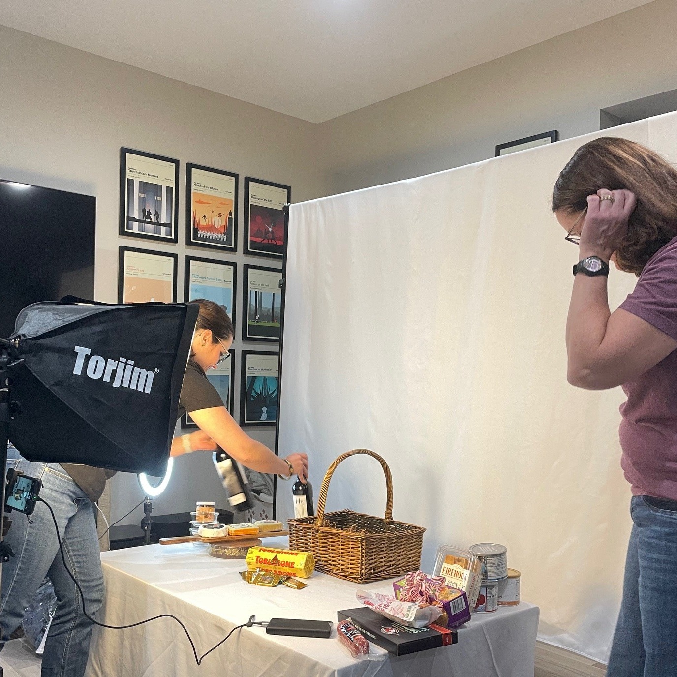 ASF volunteers photograph the amazing donated items for this year's Celebrate the Season auction.