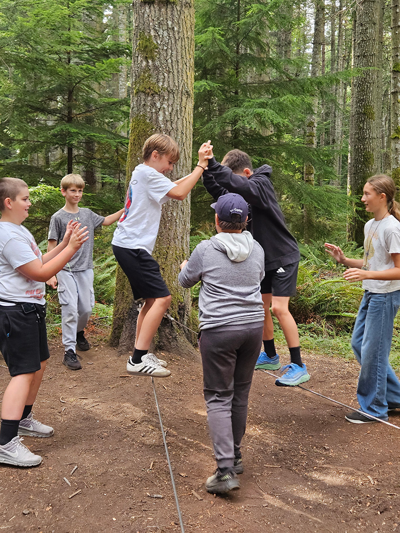 Students participate in the balance ropes course activities at Camp Orkila on a trip sponsored by Anacortes Schools Foundation.