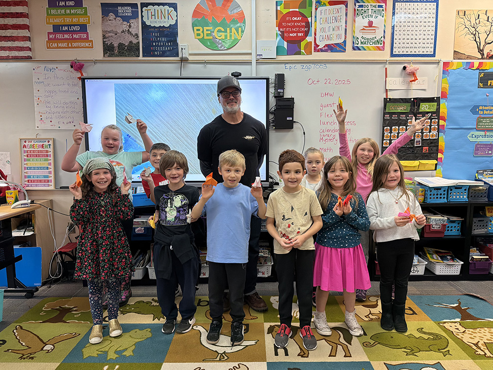 Fidalgo Elementary students proudly display their origami projects from a classroom visit with Mike Berry.